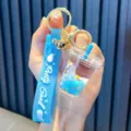Adorabile portachiavi a tazza di tè al latte unicorno arcobaleno blu con liquido e sabbie mobili - Stile Pretty Good / Blu