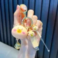 Portable cute bear keychain variant including a nail clipper and an ear pick tool - Brown Bear