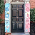 Gender reveal party door banners in pink and blue with baby-themed icons. - 30x150cm / Pink and Blue