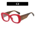 Gafas de moda con montura roja gruesa y patillas de textura madera en color C2 - Lente Transparente (C2) / Rojo