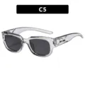 Lunettes de soleil transparentes avec verres foncés et détail boomerang, modèle C5 - Gris Transparent / Verre Gris