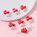Detailed view of red and white polka dot mitten beads for DIY Christmas jewelry crafts - Christmas Mitten Pendant