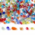 Close-up of colorful faceted glass crystal beads in various shapes for DIY jewelry making - Designated Mixed Style