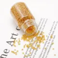 Golden 2mm round glass seed beads for DIY jewelry making stored in a clear glass bottle - 37g/Bottle Approx 3000 Pieces / Silver-Lined 2mm Golden Yellow