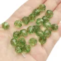 10mm faceted green crystal beads for DIY jewelry making scattered on palm - Round Beads / 10mm Approx 42 Pcs / Light Green