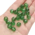 10mm emerald green faceted crystal beads for DIY jewelry making held in hand - Round Beads / 10mm Approx 42 Pcs / Green