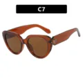 Modieuze dames oversized cat eye zonnebril met bruin doorschijnend montuur en UV-bescherming - Transparante Donkere Thee