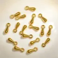 Macro view showing the metallic luster of gold water drop alloy pendants for DIY jewelry making - Water Drop Dangle / 30 Pieces/Pack (2x7mm) / Gold