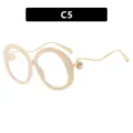 Übergroße beige Brille mit goldfarbenen Metallbügeln und elegantem Perlendetail - Beige Rahmen Klare Gläser