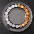 UV-lichtempfindliches Harzperlenarmband mit Farbwechsel, lebendige orange und weiße Perlen - Gelb UV Wechsel Eis Mondstein (BSB154)