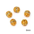 Macro view of 6mm hollow gold beads with clear rhinestones for jewelry DIY. - 20 Pieces Set / Diameter 6mm (Hole 1mm) / Electroplated Gold With White Rhinestone