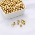 Detailed view of 14k gold filled copper beads for DIY jewelry making - 2mm (100 Pieces/Pack) / 14K Gold Filled