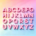 Top-down macro view of glossy pink 3D acrylic alphabet beads from A to Z for DIY - 2 Pieces/Pack (15x21mm) / Pink