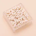 Cremefarbene erdnussförmige Zwei-Loch-Acrylperlen für DIY-Schmuckherstellungsprojekte - Ca. 100 Stück (4x6mm) / Beige