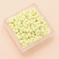 Cremegelbe erdnussförmige Acrylperlen mit Doppellöchern für DIY-Schmuckherstellung. - Ca. 100 Stück (4x6mm) / Gelb