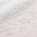 Macro detail of white AB iridescent crushed glass stones for DIY handmade craft filling - White