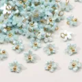 Mini breloques fleurs en résine nacrée bleu clair avec centre doré pour la création de bijoux - Fleur De Gainier / 7mm (5 pièces/paquet) / Bleu clair