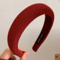 Festive French retro style padded red velvet headband featuring 'Hand Made' tag. - Plush Style
