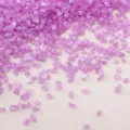 Vibrant iridescent purple crushed glass fragments for DIY craft projects and frame filling. - Pink