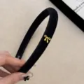 Elegant black velvet narrow headband with a small gold bow accent for stylish hair styling - Narrow Bow Headband / Black