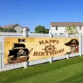 Outdoor pirate themed happy birthday banner backdrop with skull captain and ship - 30x120cm (Grommets and Rope)