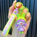 Adorable cartoon rabbit girl keychain pendant in vibrant purple and lime green finish - Rabbit Girl / Green