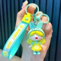 Cartoon mint green rabbit girl keychain with yellow dress and silicone hand strap - Rabbit Girl / Lake Blue