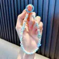 Handmade blue beaded phone strap with bear charm and bow decoration, SKU variant view - Blue