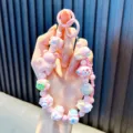 Adorable pink beaded cartoon bear phone charm and keychain featuring a sparkling rhinestone ball - Pink