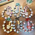 Colorful handmade beaded butterfly keychains and phone straps with hand-painted charms. - Butterfly Hand-painted Bead Bracelet