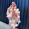 Leuke roze kralen telefoonkoord met vliegtuig bedeltje dopamine stijl voor tassen decor - Roze