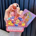 Cute pink Genki Duck piano keychain accessory with 7 numbered buttons for bag decoration - Pink