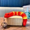 Simpatico portachiavi a forma di serpente articolato rosso e giallo per borse e auto - Rosso