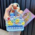 Cute yellow duck piano-shaped keychain with blue bell and mini keyboard accessory - Blue