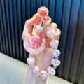 Adorable handmade beaded phone strap with a pink moon girl keychain and bag charm - Pink