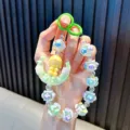 Handmade beaded moon girl keychain phone strap with pastel beads and cute charm - Green