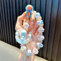 Handmade blue beaded keychain with astronaut and moon charm for phone and bag decor - Blue