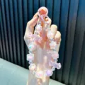 Iridescent crystal beaded phone charm with candy pendant in pink and purple shades. - Pink