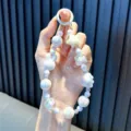 Handmade white bunny beaded phone charm with iridescent star and rainbow round beads - White