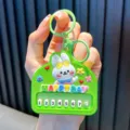 Cute green rabbit piano keychain with Happy Day message and number keys - Green