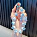 Blauer handbemalter Perlen-Schlüsselanhänger mit irisierendem Schleifenanhänger und Clips - Blau