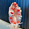 Handcrafted red and white beaded phone strap featuring a pixel heart and beaded bow detail - Red Heart Bowknot Style