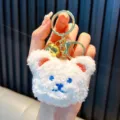 Adorable white plush bear keychain with blue embroidery features and a gold bell accessory - Teddy Bear / White