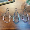 Elegant handmade beaded butterfly keychain charm for phone case or bags, blue and pink - Alloy Butterfly Lantern