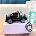 Cool black pull-back toy truck keychain with silver flame decals for backpack decor - Black