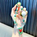 Christmas-themed green and white beaded phone chain with wreath pendant and fluffy ball - Christmas Wreath Style (Beaded Christmas) / Green (With Gasket)