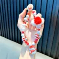 Handmade Christmas snowman beaded phone charm with red plush ball and festive red beads - Christmas Snowman Style / White - Beaded Christmas Plush Ball