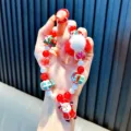 Festive Christmas beaded phone strap featuring Santa Claus charm and soft white pom pom - Red - Beaded Christmas Plush Ball