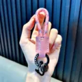 Pink woven rope keychain with leather accent and black metal ring - Pink