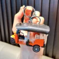 Mini orange Tuk Tuk tricycle keychain model with pull-back toy function for boys - Orange